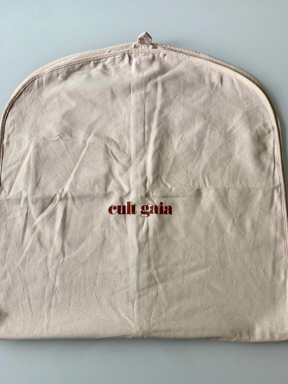 Cult Gaia Canvas Garment Cover in Beige with Red Logo 50”x 24”